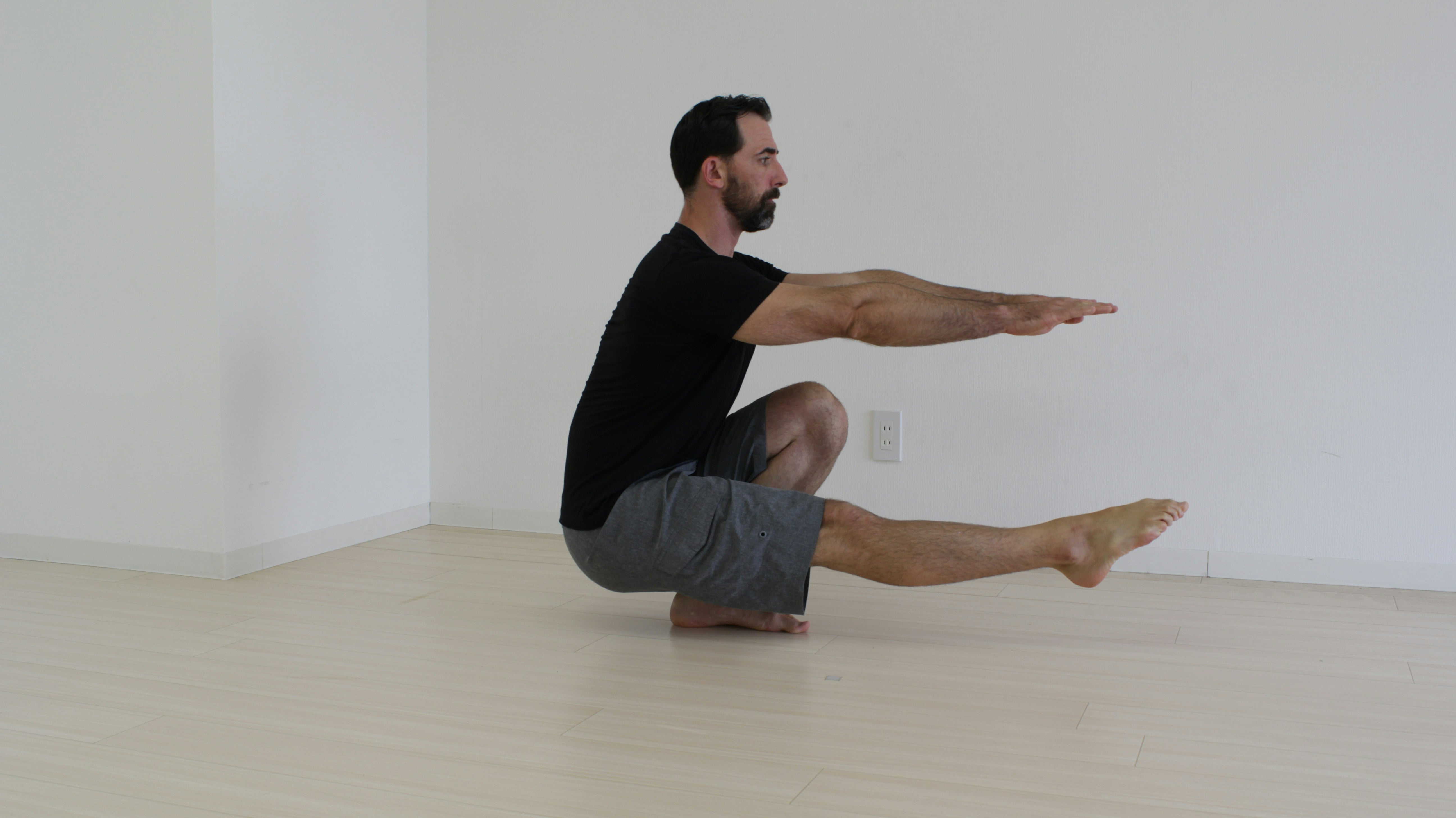 man doing pistol squat bodyweight exercise