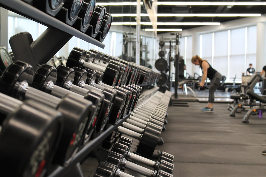 Corporate consultant hotel gym dumbbell back workout — posture correction and strength for road warriors