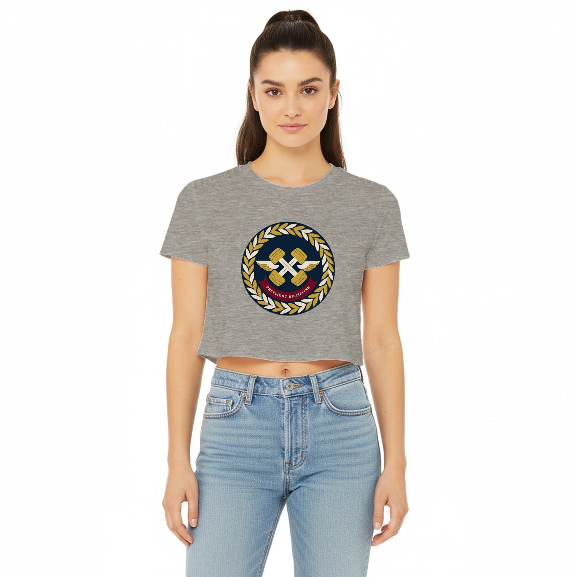 Preflight Discipline winged-dumbbell crest with laurel wreath on a women's crop tee by Dumbbells & Hotels — view 7 of 7