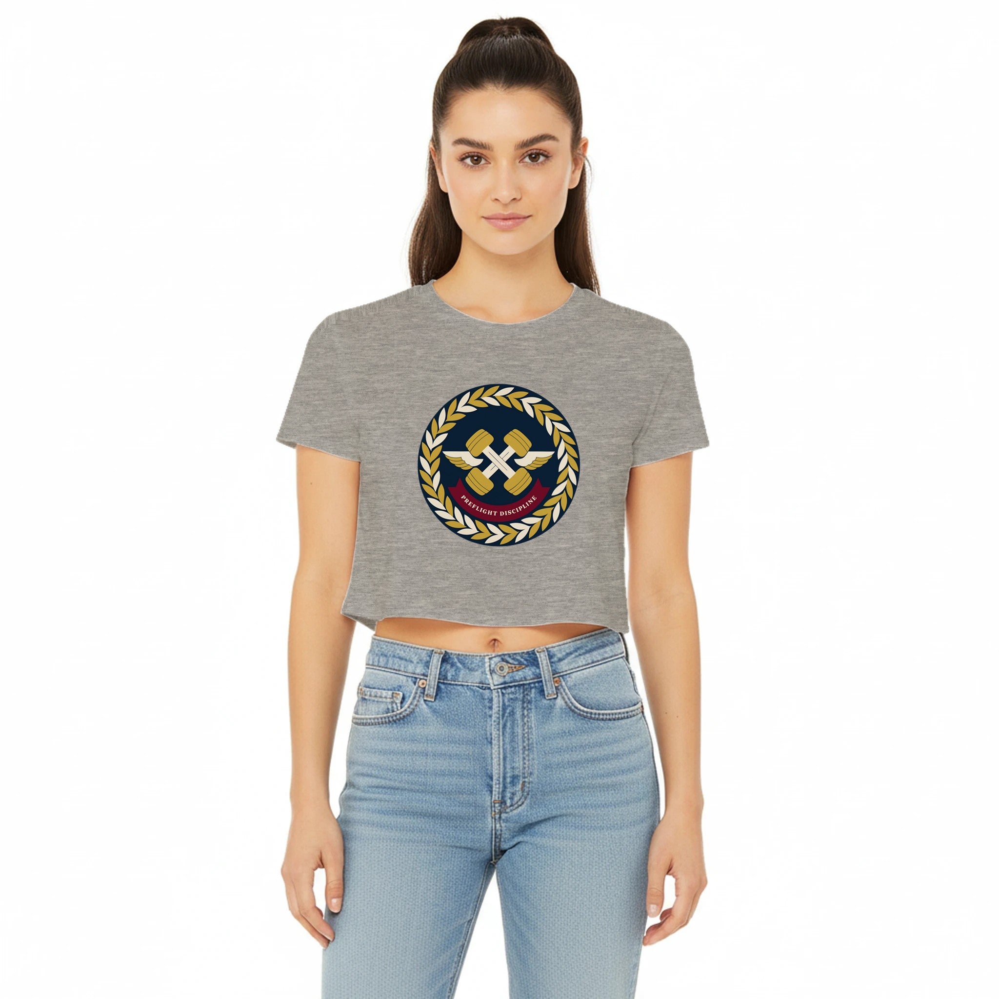 Preflight Discipline winged-dumbbell crest with laurel wreath on a women's crop tee by Dumbbells & Hotels — view 7 of 7