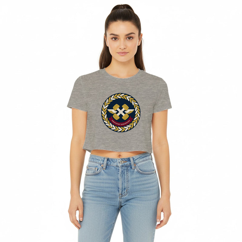 Preflight Discipline winged-dumbbell crest with laurel wreath on a women's crop tee by Dumbbells & Hotels — view 7 of 7