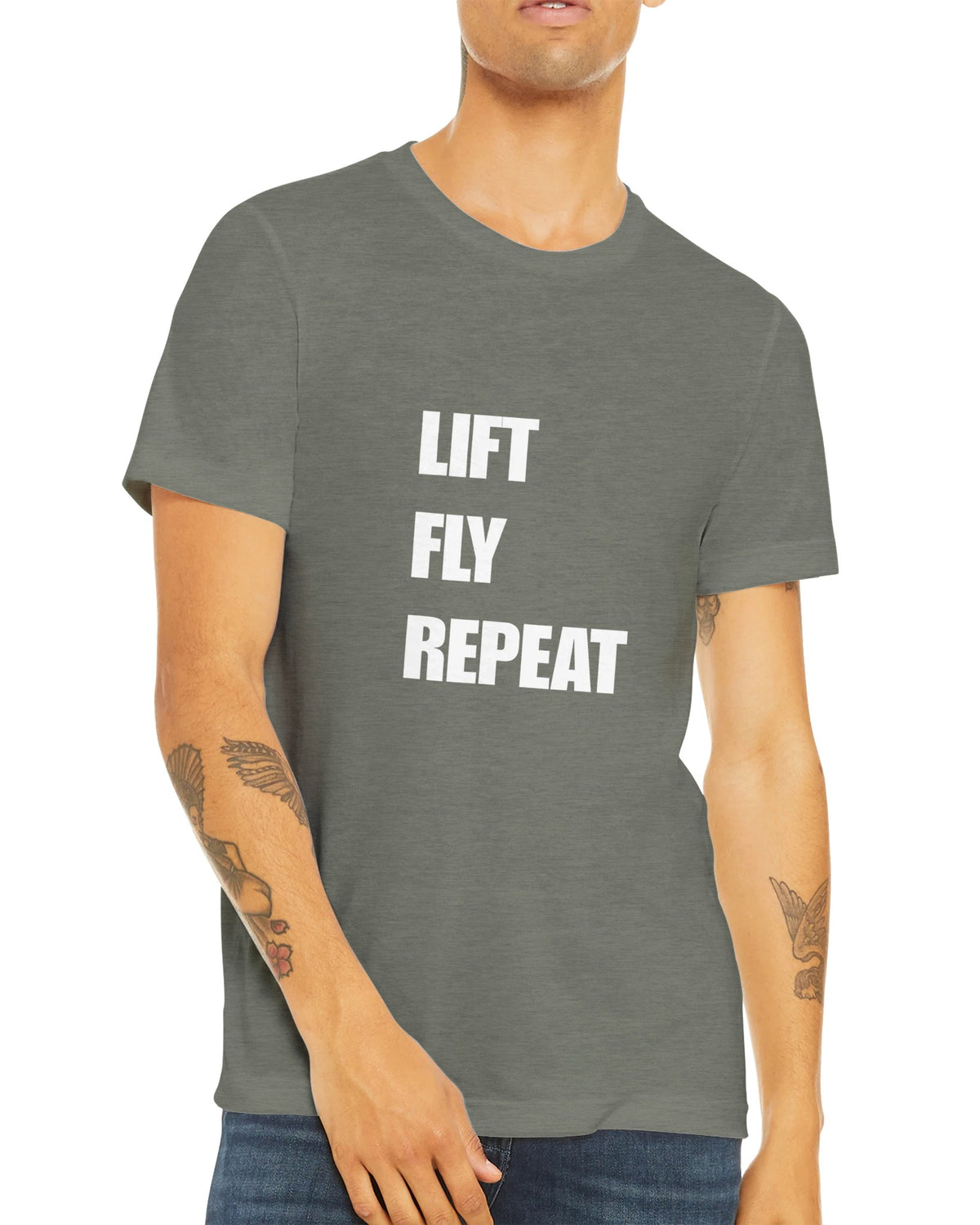 Lift Fly Repeat unisex triblend tee for travelling professionals, printed with a laurel-wreath crest with crossed dumbbells, aviator wings and a LIFT. FLY. REPEAT. ribbon — product photo 18 of 19