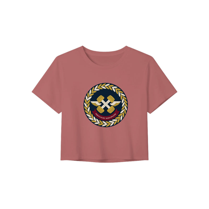 Preflight Discipline winged-dumbbell crest with laurel wreath on a women's crop tee by Dumbbells & Hotels — view 6 of 7