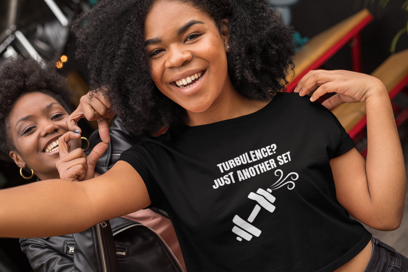 Road warrior crop top worn off-duty — veteran-founded travel apparel for the traveling professional