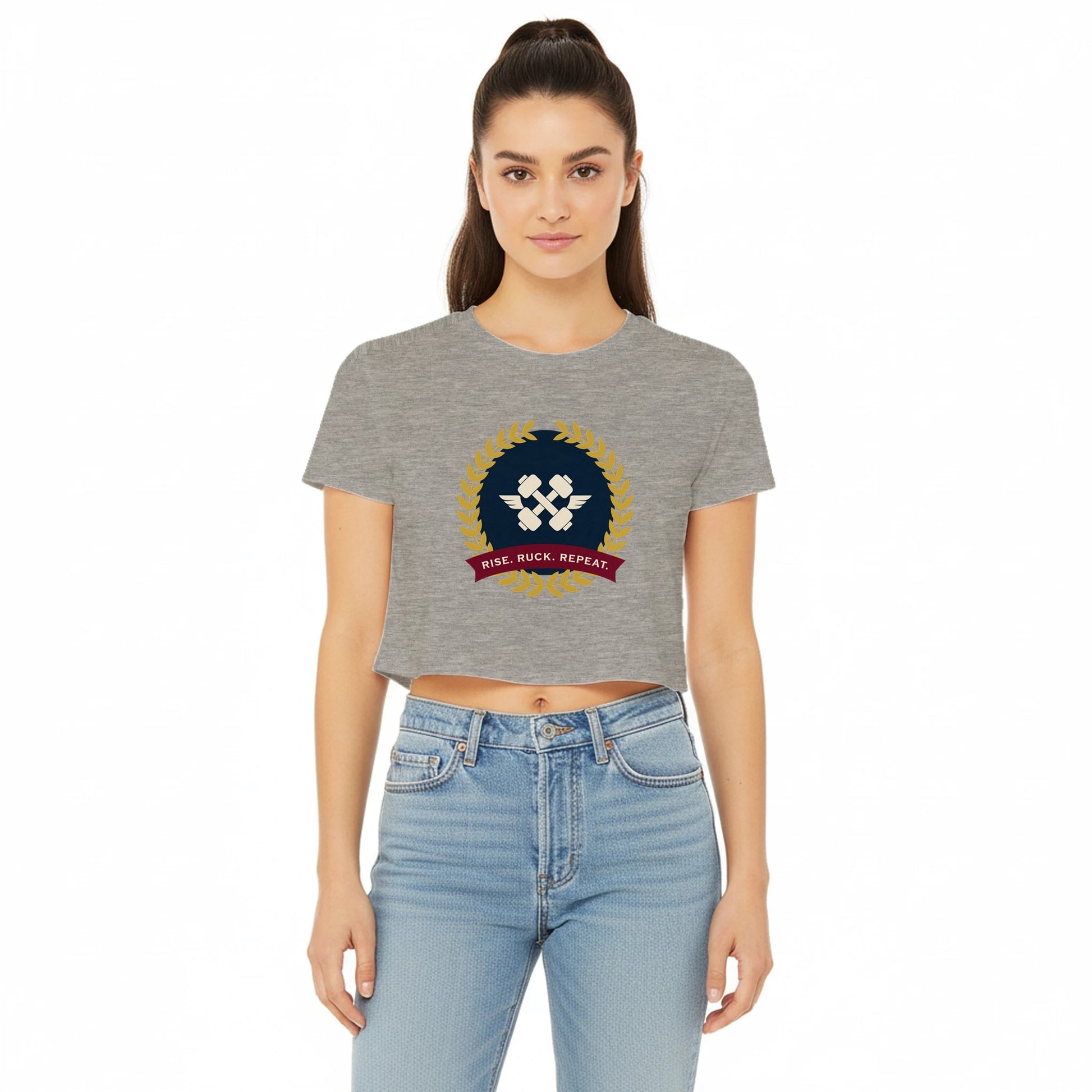Rise. Ruck. Repeat. artwork detail on a women's flowy crop tee designed for hotel gyms and long layovers