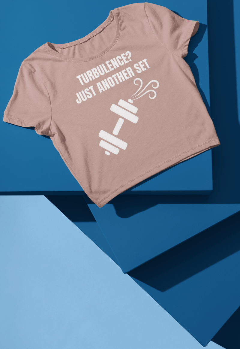 Hazy Pink women's crop top flat-lay — Turbulence? Just Another Set travel fitness apparel