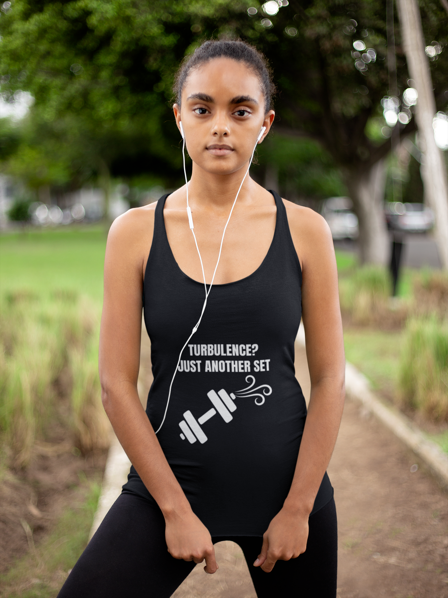 Woman wearing Dumbbells and Hotels Turbulence travel workout racerback tank at the park - Flight Tested