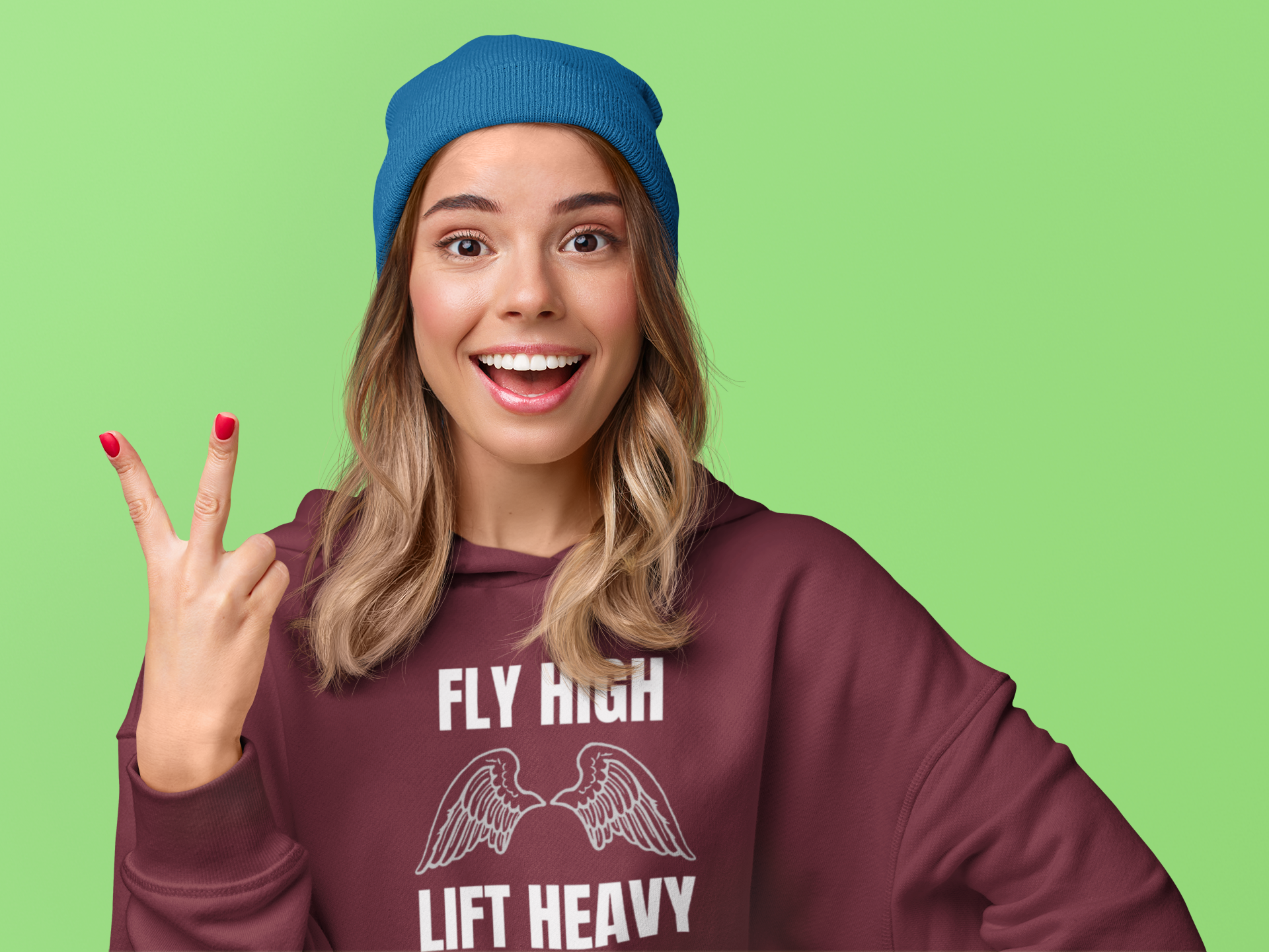 Cheerful female traveler in maroon Fly High Lift Heavy hoodie — wrinkle-resistant technical fit road warrior apparel