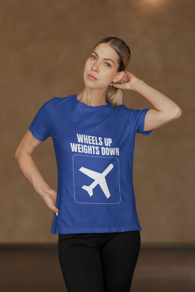 Woman in royal blue Wheels Up Weights Down travel gym t-shirt, fitness-themed lifestyle photograph for business travelers and road warriors