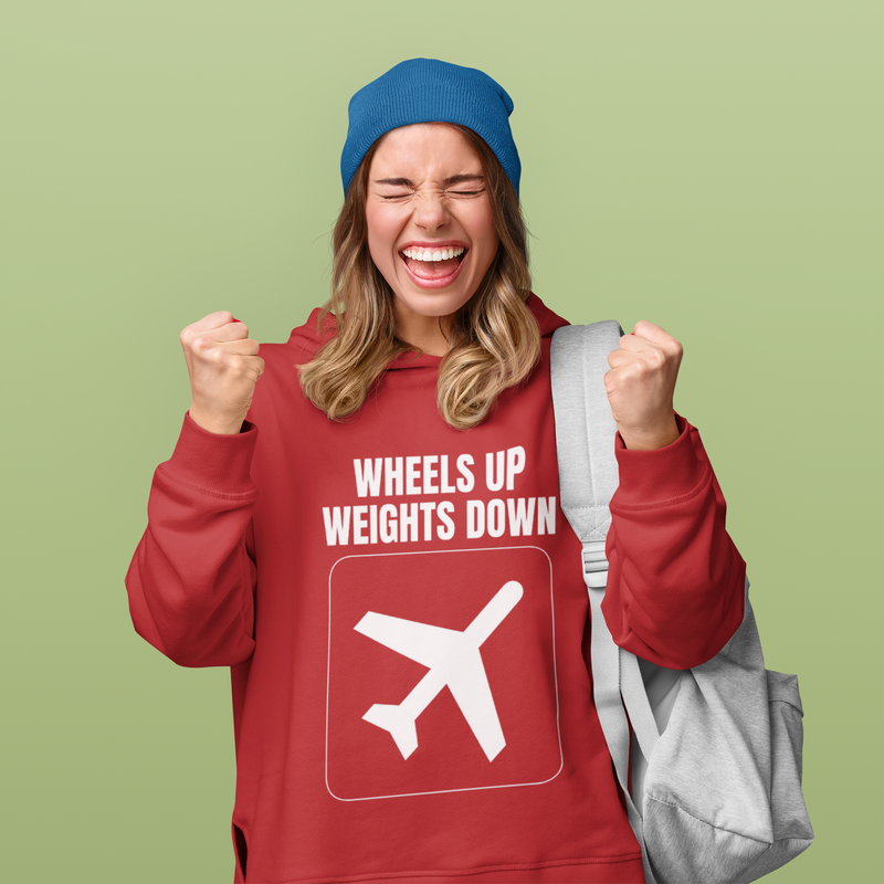 Flight tested travel workout hoodie in red — lifestyle shot for the modern road warrior
