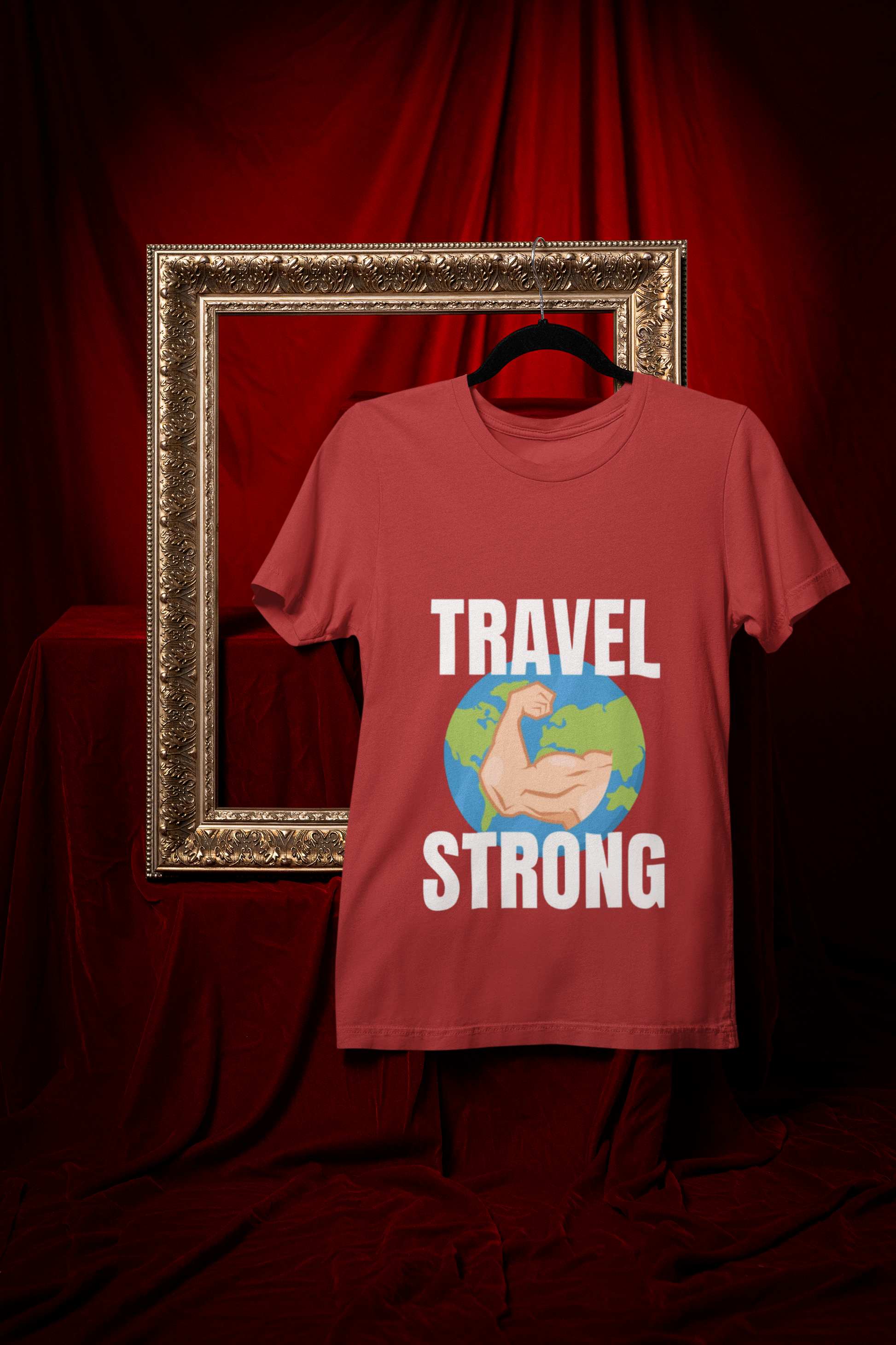 Travel Strong unisex t-shirt in Red hanging in vintage frame — designed by pilots for the hotel gym
