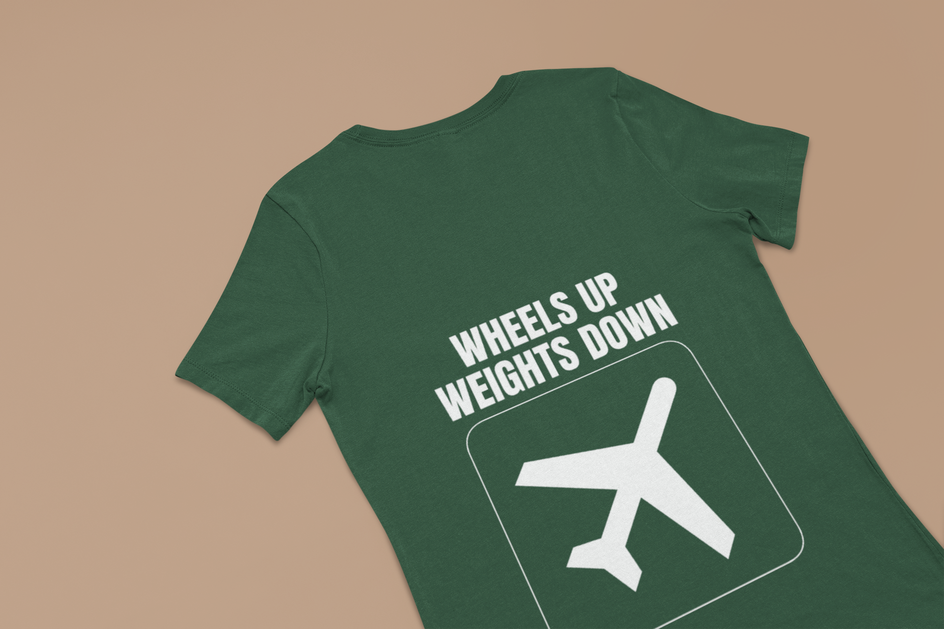 Forest green Wheels Up Weights Down unisex travel gym t-shirt flat-lay, flight-tested travel fitness apparel