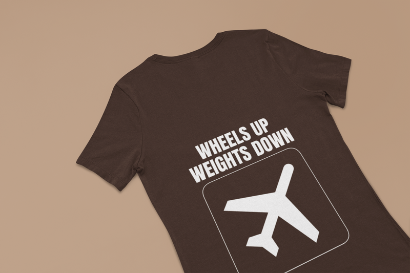 Dark chocolate Wheels Up Weights Down unisex travel gym t-shirt flat-lay, premium travel gym apparel for pilots and flight crews