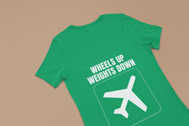 Irish green Wheels Up Weights Down unisex travel gym t-shirt flat-lay, flight-tested travel gym apparel